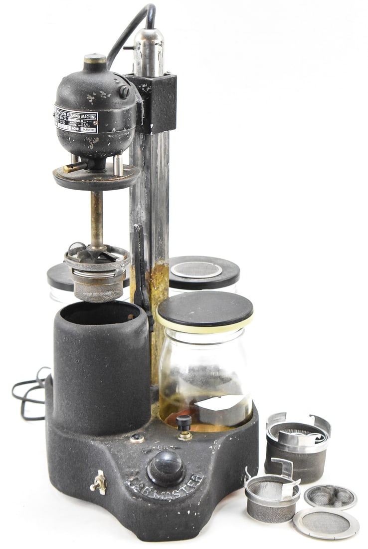 L&R PRECISION CLEANING MACHINE: A L& R Precision Cleaning Machine Mark 1 watch cleaning machine, circa 1930's. The machine included the multiple cleaning compartments and a variety of mesh watch part holder. The item measures