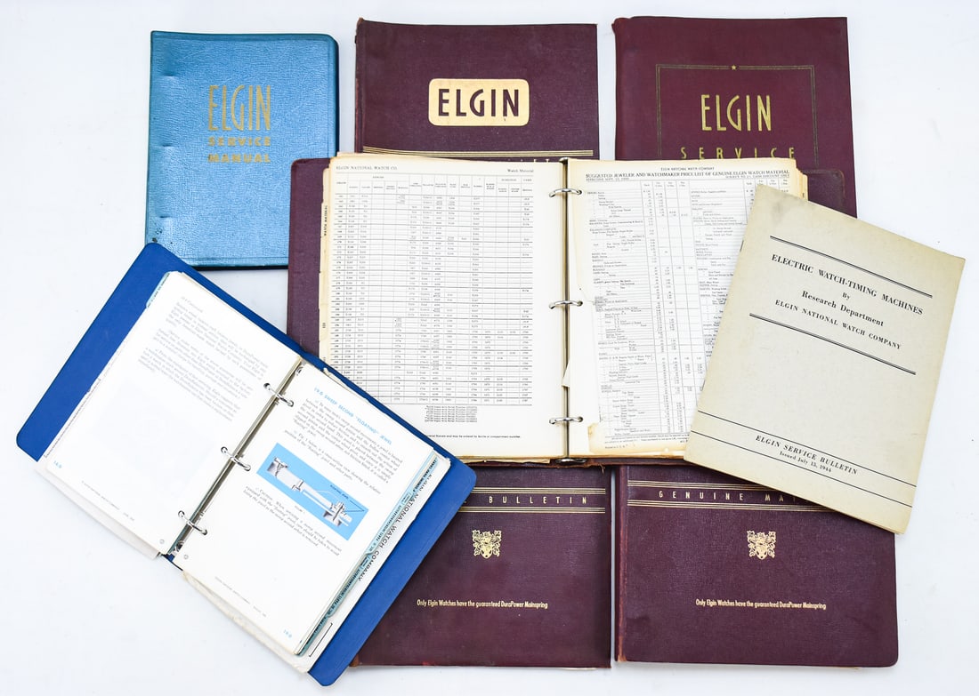 LOT OF ELGIN NATIONAL WATCH COMPANY MANUALS/CATALOGS CIRCA 1950: This lot includes the Electric Watch-Timing Machines catalog from 1944, two genuine watch material catalogs from 1953, three service bulletin catalogs without dates and the service manual sections 1