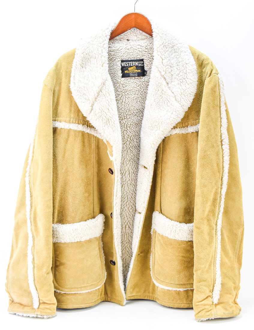 VINTAGE SEARS "WESTERN OUTDOOR WEAR" BROWN SUEDE HUNTING COAT: A vintage 1970s Sears "Western Outdoor Wear" light brown suede hunting coat with a faux sherpa lining. The coat is sized a men's large and measures approx. 26" pit-pit and 33" back of the collar-hem.