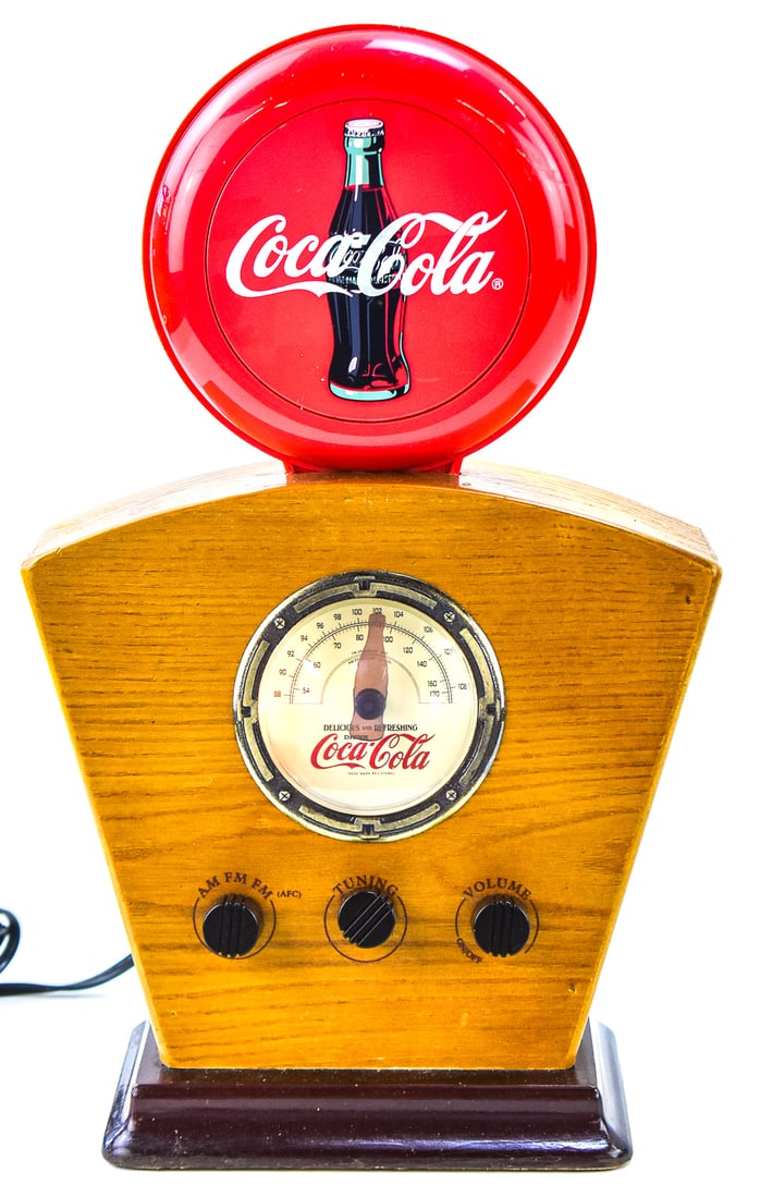 COCA-COLA AM/FM RADIO: While the radio looks like it is from the 1940s, these clocks actually came out in the 1980s-90s. The body of the radio is a high quality plastic with a grain finish. The clock measures 14.5" H, 9.5" 