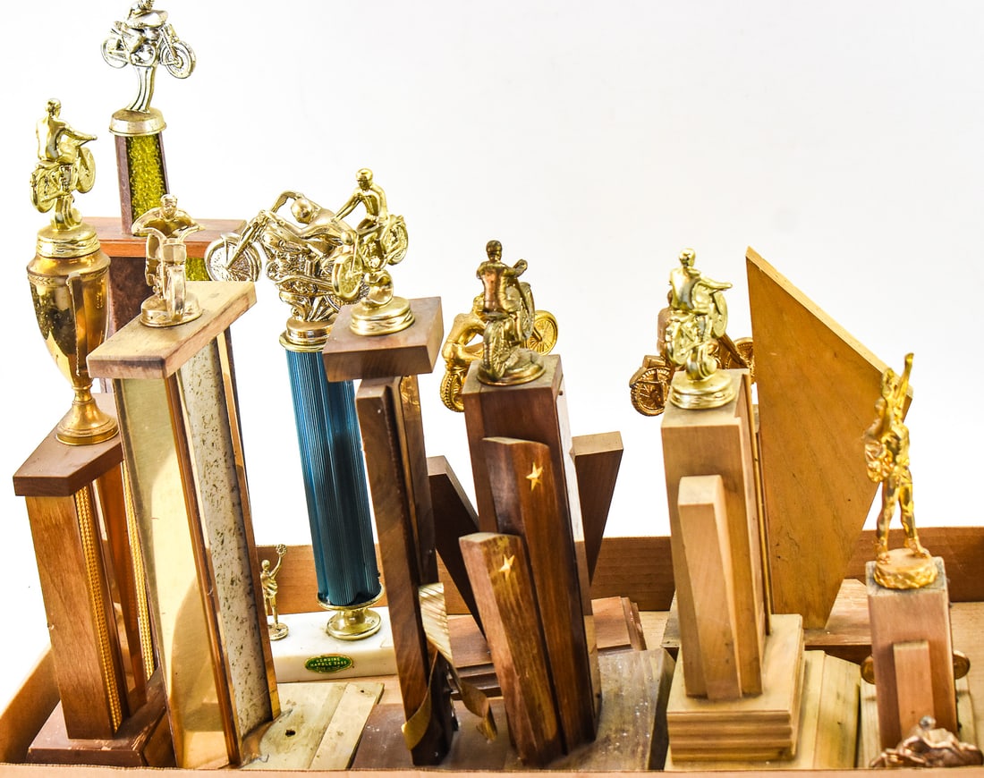 COLLECTION OF 1960's MOTORCYCLE RACING TROPHIES: A collection of ten 1960s motorcycle racing trophies from Oregon races. These trophies originated from the John Taylor Honda Store of Woodburn, Oregon. The largest measures 19" H x 5.5" W x 3" D.