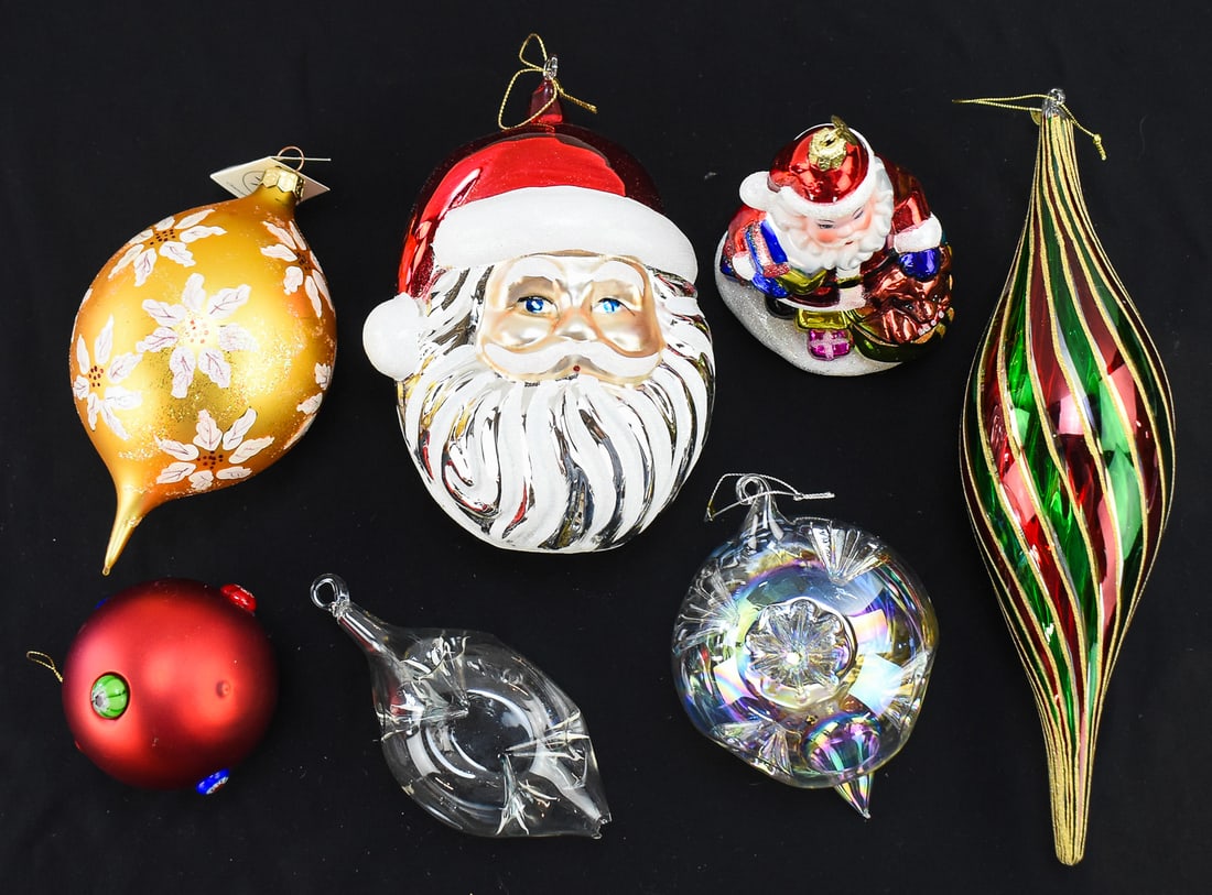 COLLECTION OF SEVEN LARGE GLASS CHRISTMAS ORNAMENTS KOMOZJA, CHRISTOPHER RADKO & MORE: A collection of seven large glass christmas ornaments which includes a Komozja Family "Santa Head", a Christopher Radko jumbo teardrop, a Christopher Radko "Santa with puppy & gifts" a 11"H x 3"W 