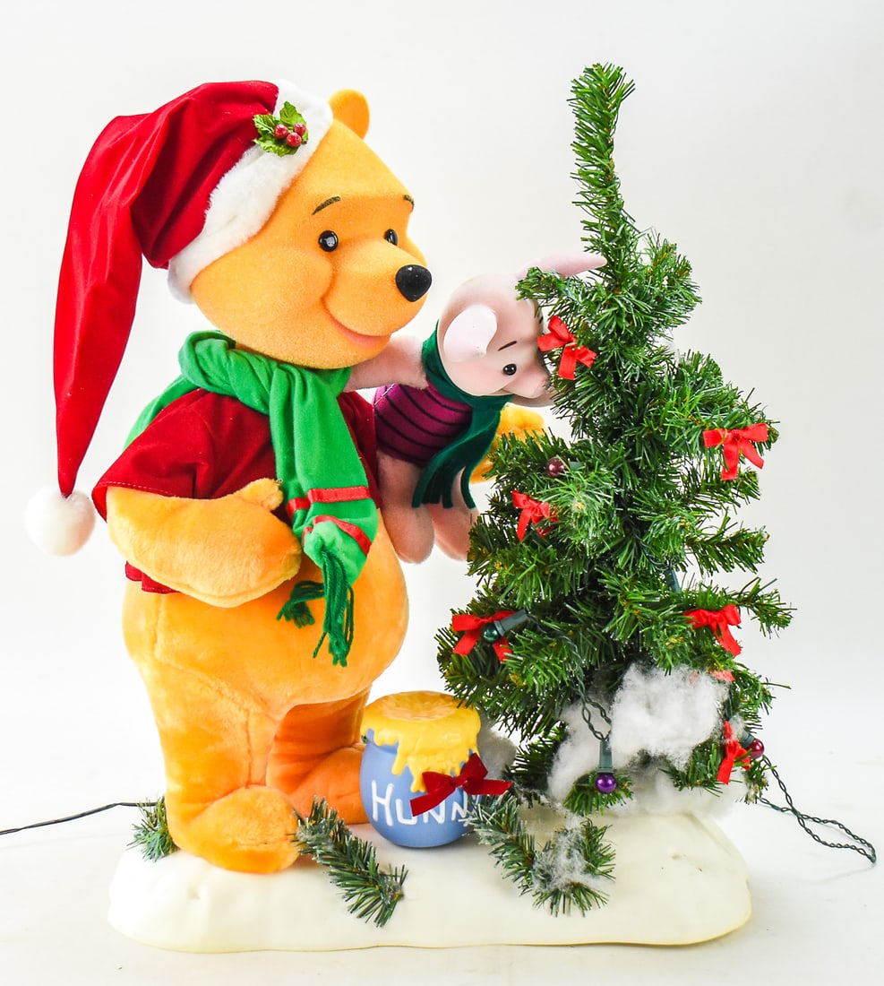 1997 DISNEY WINNIE THE POOH & PIGLET ANIMATED CHRISTMAS DISPLAY: A circa 1997 DIsney Winnie the Pooh & Piglet animated Christmas display. The display is musical and lighted and measures approx. 23" H x 17" W x 10" D.