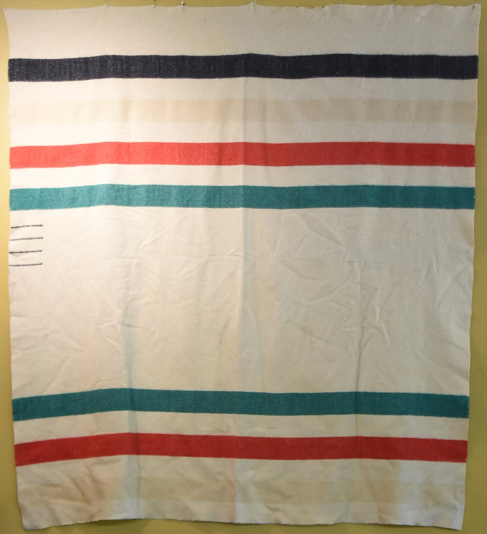 HUDSON BAY 4 POINT WOOL BLANKET: This blanket is made of wool circa the mid 20th century. The blanket would fit a double or full sized bed. The blanket measures approx. 80" H x 70" W x 0.5" D. Contrary to myths, the bl