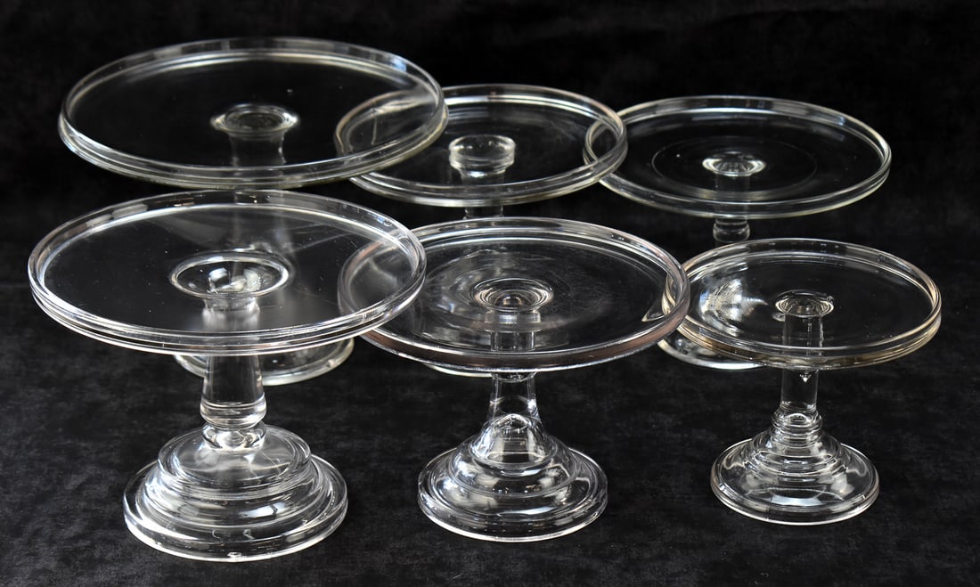 SIX CHALLINOR, TAYLOR AND COMPANY (ATTR.) EARLY AMERICAN PRESSED GLASS PEDESTAL CAKE STANDS: This lot includes six Challinor, Taylor and Company No. 900 (attributed) Early American Pressed Glass pedestal cake stands, from the late 19th century. The largest item measures approx. 7.5" H x 10.5"