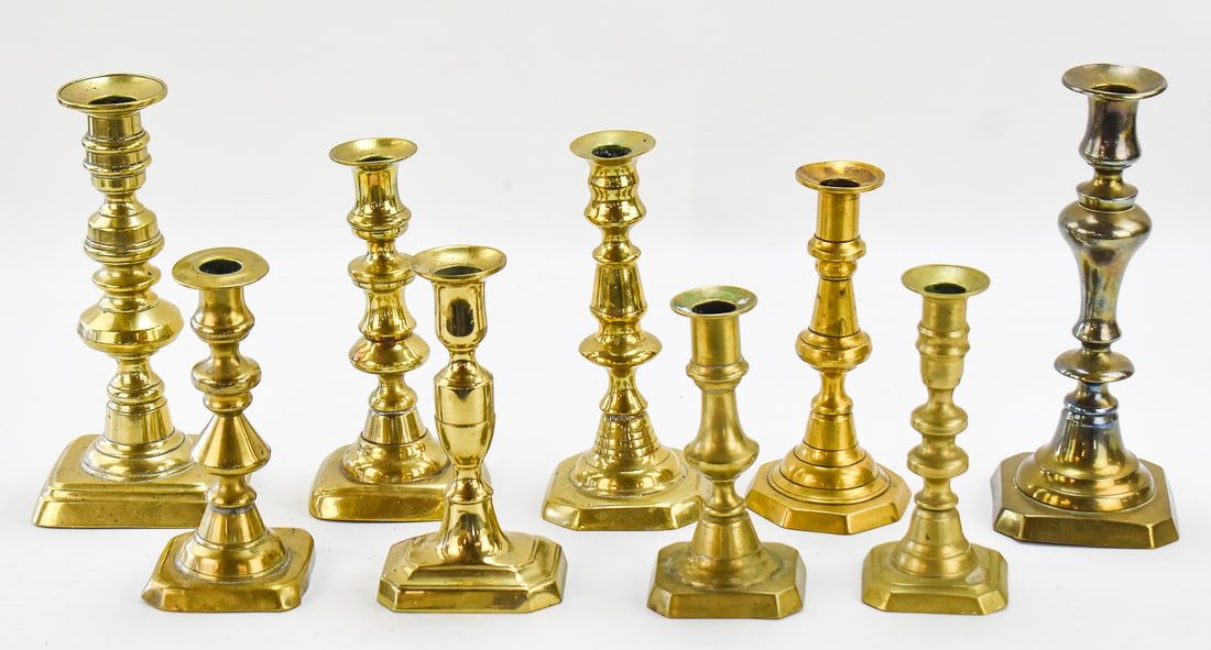 NINE ENGLISH-STYLE BRASS CANDLESTICKS (1 of 2)