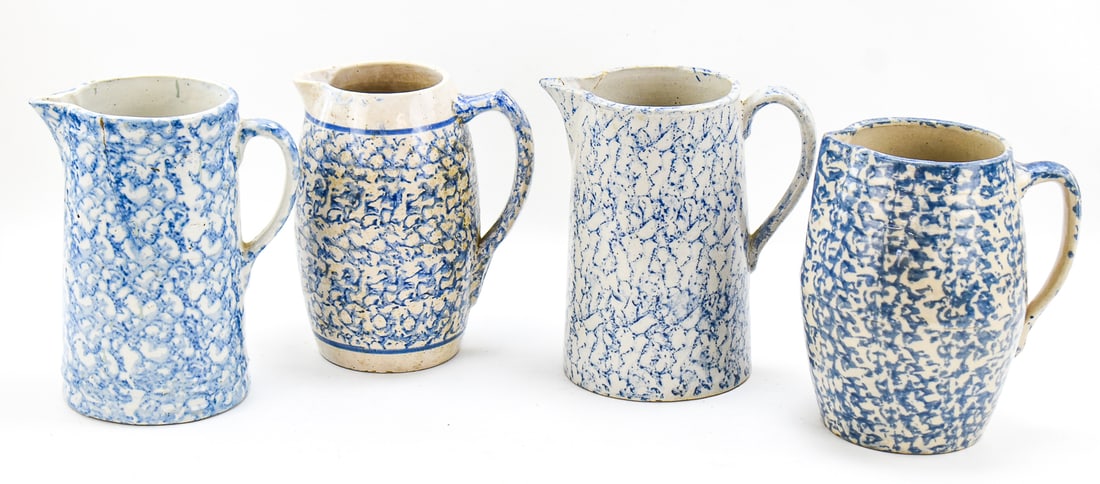 FOUR BLUE-AND-WHITE SPONGEWARE PITCHERS (1 of 7)