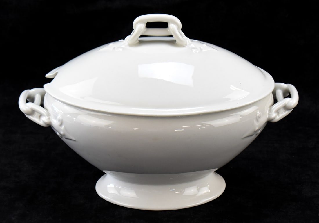 CHARLES FIELD HAVILAND LIMOGES FRENCH PORCELAIN SOUP TUREEN: A Charles Field Haviland (Limoges, France) white porcelain soup tureen with matching lid, circa 1868. The base of the tureen is marked "CFH 2". The item measures approx.10" H x 14" W x 8" D.