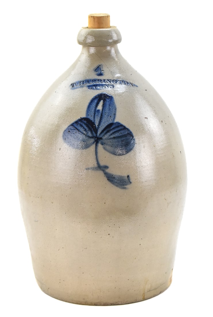 THOMPSON HARRINGTON FOUR-GALLON STONEWARE JUG: A marked Thompson Harrington (Lyons, NY) four-gallon stoneware jug with a cobalt leaf motif, from between 1852-1872. Jug measures approx.17" H x 10.5" W x 10.5" D.