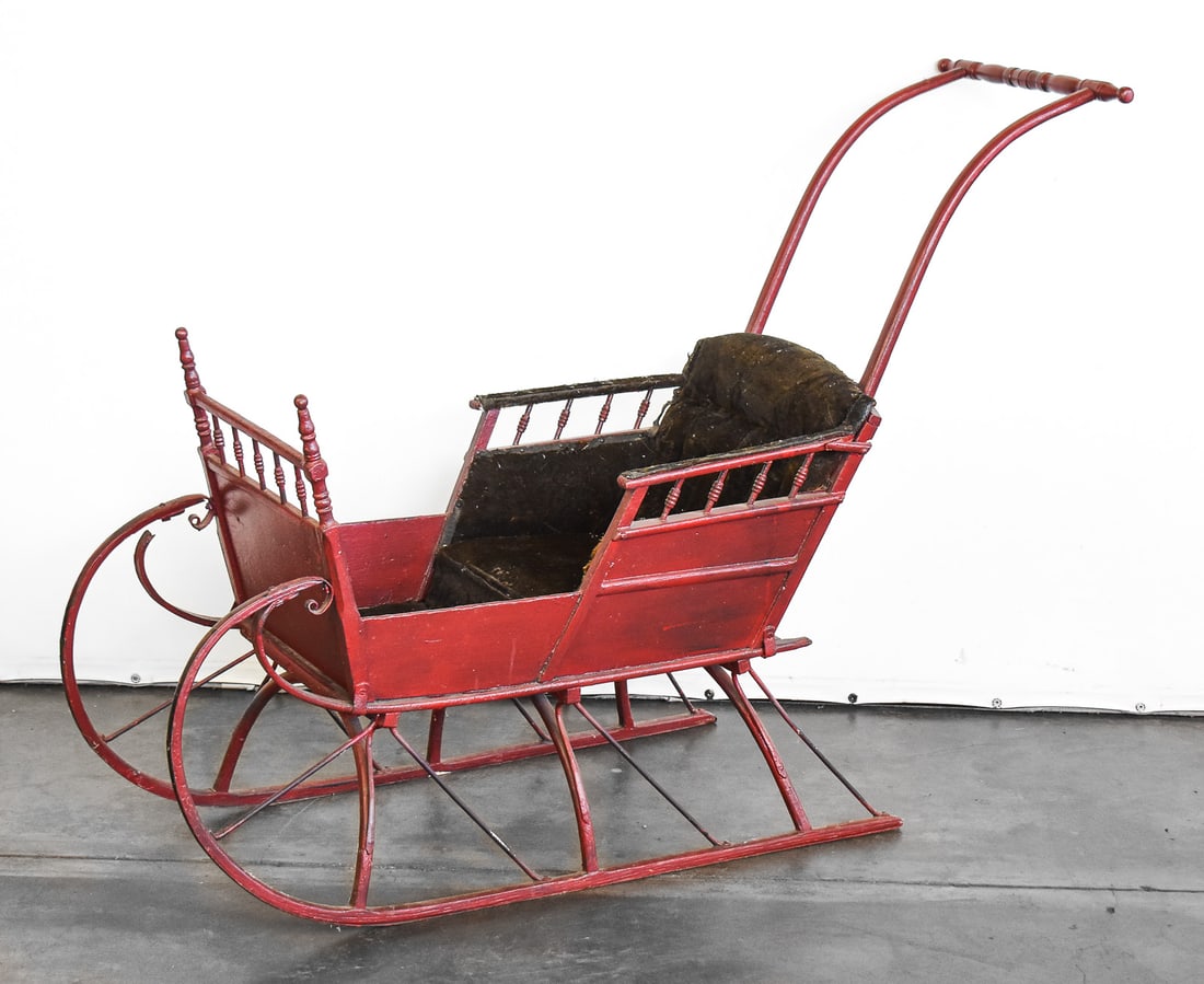VICTORIAN CHILDREN'S PUSH SLEIGH: A Victorian children's painted wooden push sleigh, circa late 19th century. The item measures approx. 36" H x 50" W x 16" D.