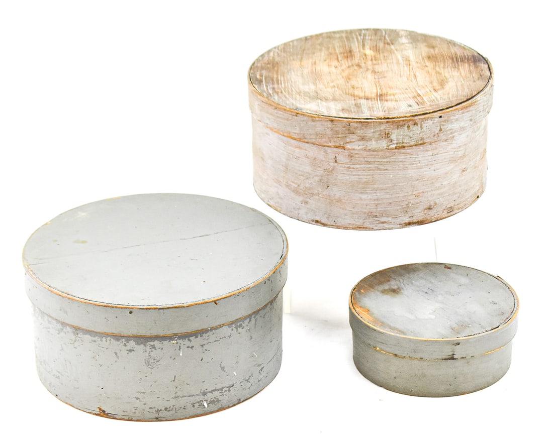 THREE GREY MILK-PAINTED BENTWOOD PANTRY BOXES: This lot includes three bentwood milk-painted grey pantry boxes, from late 19th century: two are of a larger size and one of a smaller size. The largest item measures approx. 4.5" H x 9" W x 9" D.