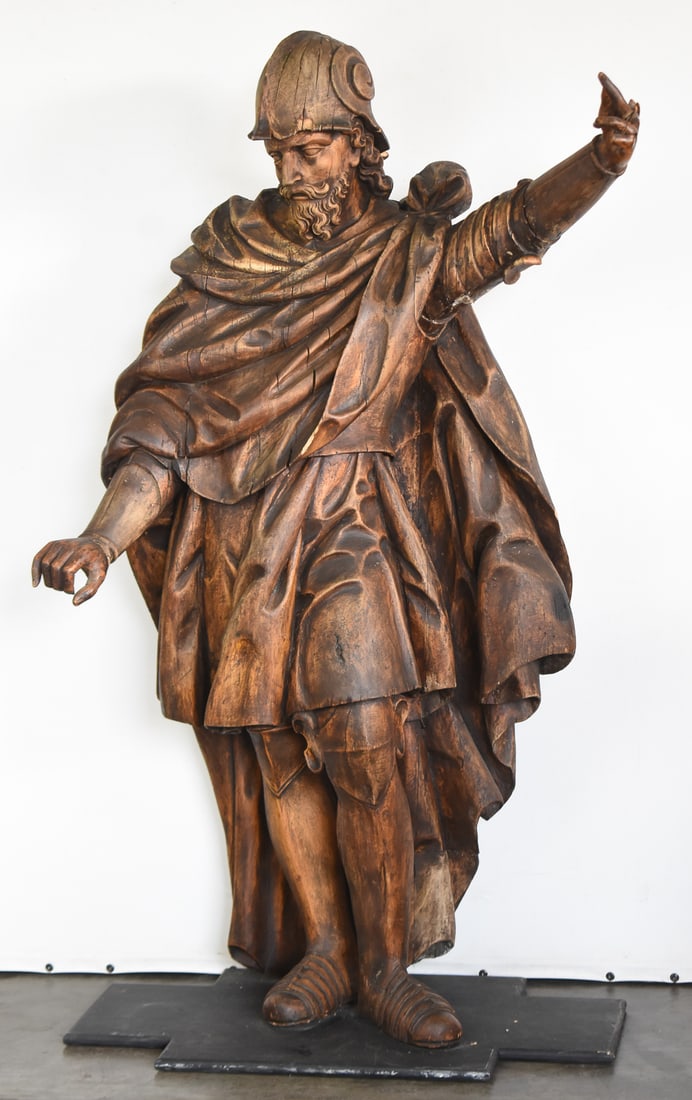 18TH CENTURY SAINT FLORIAN OAK STATUE: A carved oak statue statue likely depicting Saint Florian, from the 18th century. The item measures approx. 58" H x 37" W x 19" D.