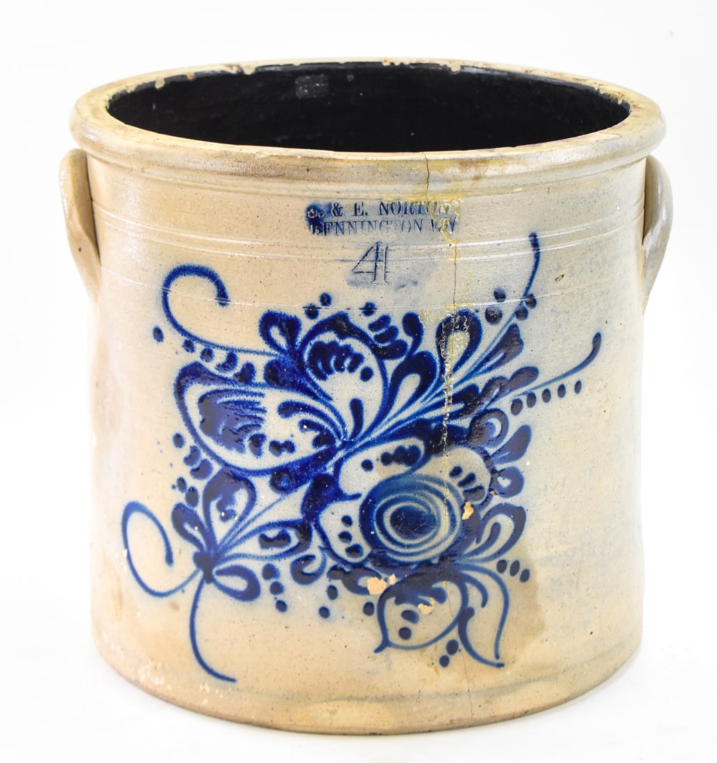 J. & E. NORTON FOUR-GALLON STONEWARE CROCK: A marked J. & E. Norton (Bennington, VT) marked four-gallon stoneware crock with a cobalt floral design, circa 1850s. The item measures approx. 11" H x 13" W x 12" D.