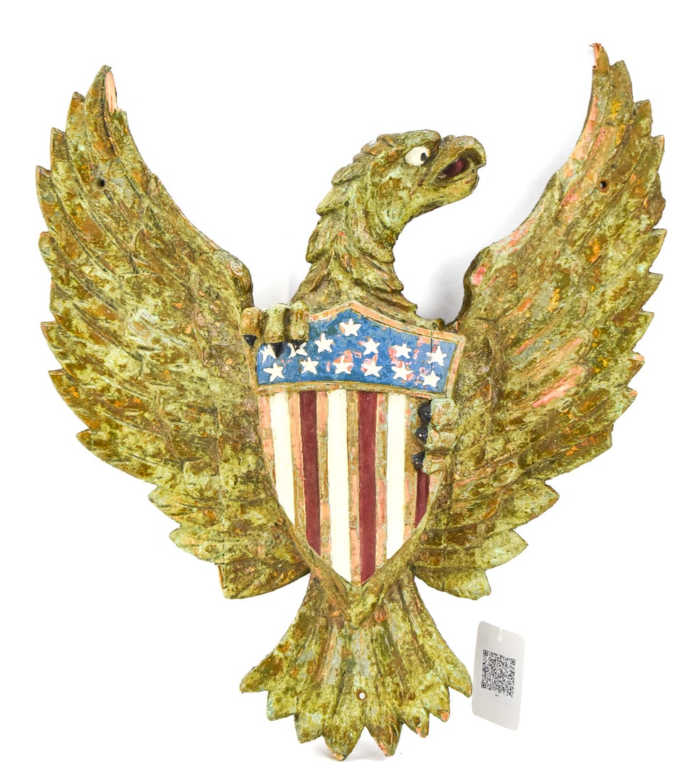 CARVED & PAINTED HANGING PATRIOTIC EAGLE: A carved and painted wood patriotic eagle resembling the United States "Coat of Arms". It has a wire on the back for hanging and it measures approx. 20" H x 19" W x 3.5" D.