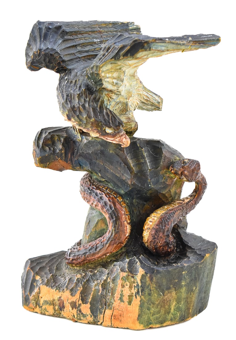 SOVIET CARVED BASSWOOD ALLEGORICAL EAGLE AND SNAKE SCULPTURE: A Soviet era hand-carved and painted basswood allegorical sculpture depicting an eagle (likely the Pyatigorsk Eagle) in battle with a snake, from mid-late 20th century. The item measures approx. 12.5"