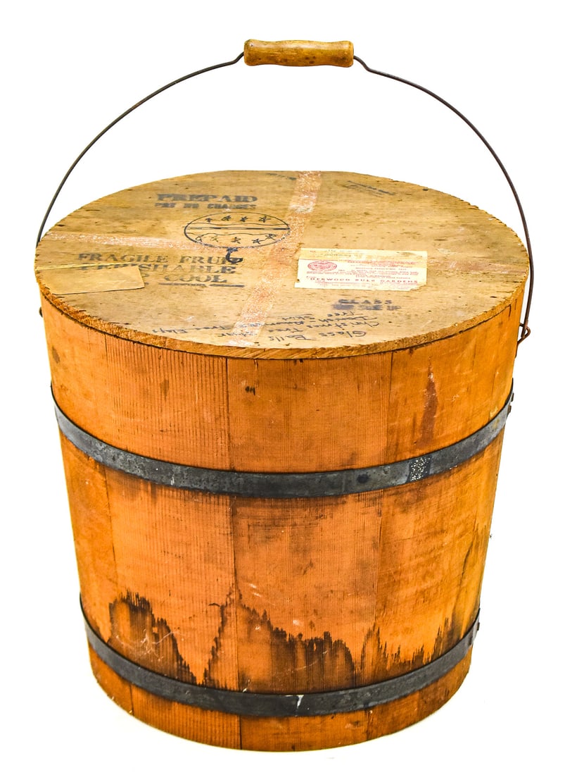 AMERICAN PINE STAVED PLANT BUCKET: An American staved pine plant bucket with metal banding, from late 19th to early 20th century. The bucket has a shipping label which indicates that it was utilized by the Sherwood Bulb Garden, OR.