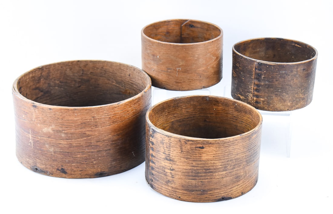 SHAKER BENT OAK DRY GRAIN BINS: Four Shaker bent oak dry grain bins. One is stamped by S.N. Farrar, Royalston, Massachusetts and two of the others were made in New Hampshire. The largest measures approx. 7" H x 11.5" W x 11.5" D.