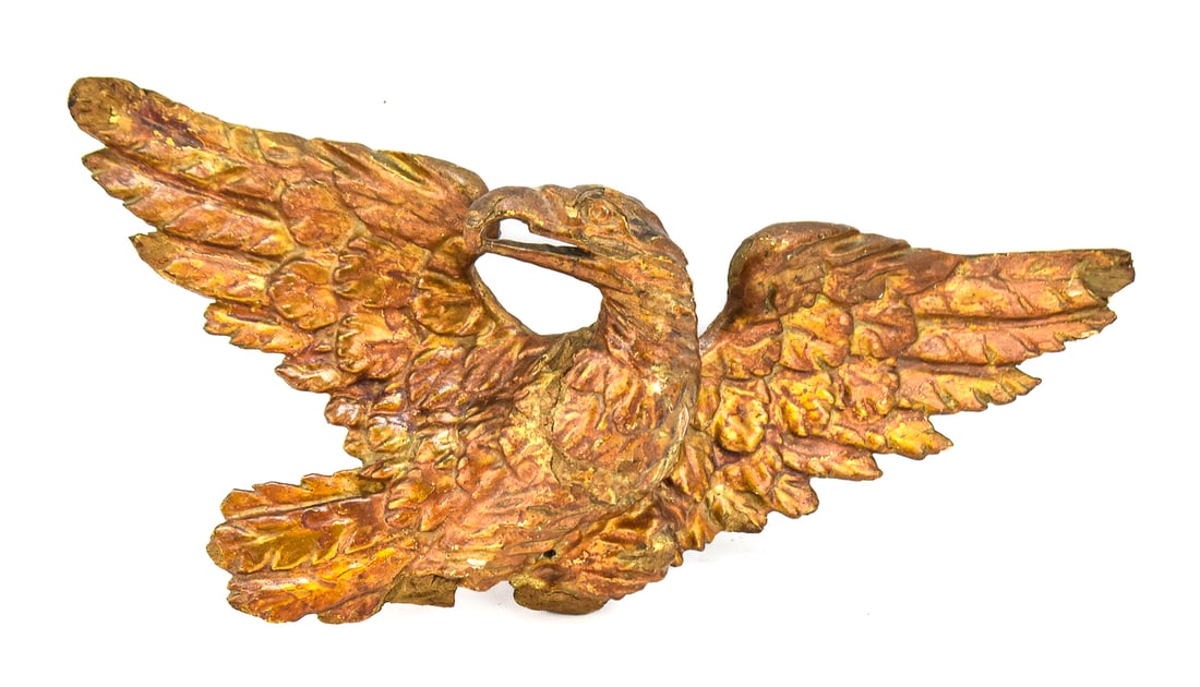 AMERICAN FEDERAL STYLE CARVED GILT EAGLE: An American Federal style gilt carved pine eagle, from the 19th to early 20th century. The item measures approx. 7" H x 16" W x 4.5" D.
