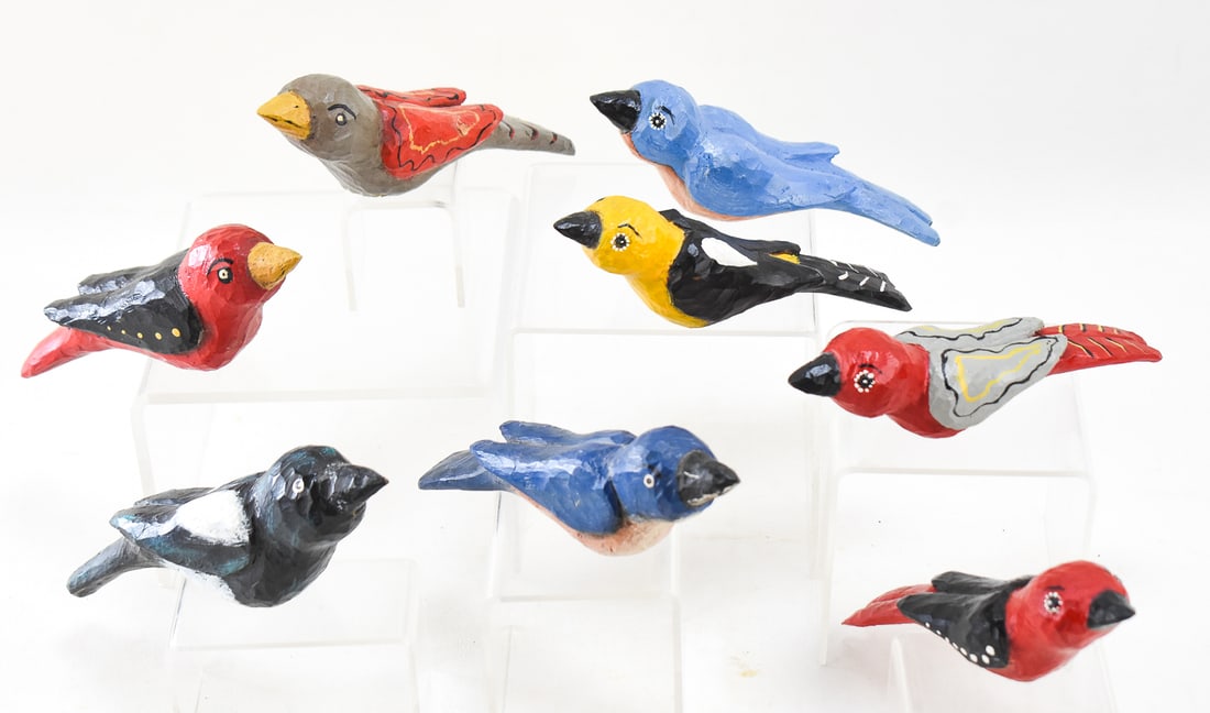 HAND CARVED & PAINTED FOLK ART BIRDS: Eight hand carved and hand painted folk art wooden birds. Each measures approx. 2.5" H x 7" W x 2" D.