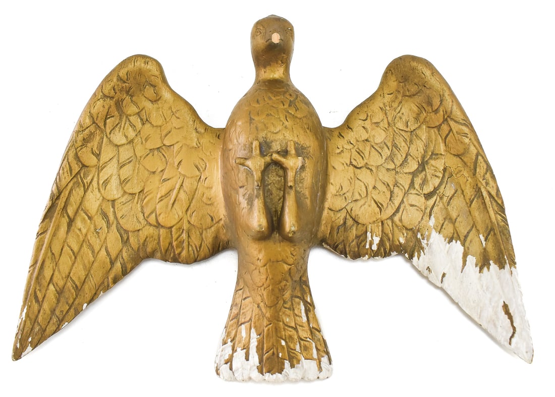 CARVED GILTWOOD EAGLE HANGING SCULPTURE: A carved giltwood eagle hanging sculpture that has been painted gold and has a hoop on the backside to be hung. It measures approx. 13.5" H x 19.5" W x 3.5" D.