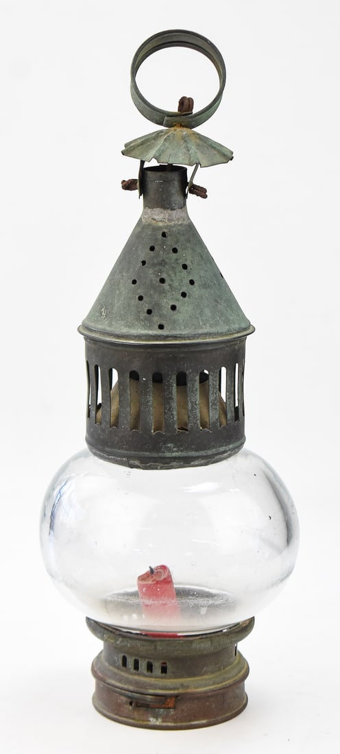 WHALE OIL-CAMPHENE PUNCHED TIN ONION GLOBE LAMP: A whale oil-camphene punched tin onion globe lamp converted to candle use in size No. 2, from the mid-late 19th century. The lantern measures approx. 16" H x 5.5" W x 5.5" D.