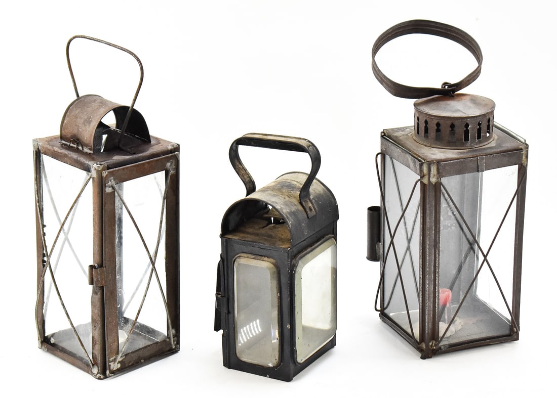 THREE TIN CANDLE LANTERNS: ROHRMAN, A. MURCOTT & COMPANY, AND MORE: This lot includes three tin candle lanterns, from the mid 19th-early 20th century: Rohrman (Philadelphia, PA) "Universal Lantern", A. Murcott & Company (Birmingham, England) railroad signal cabine