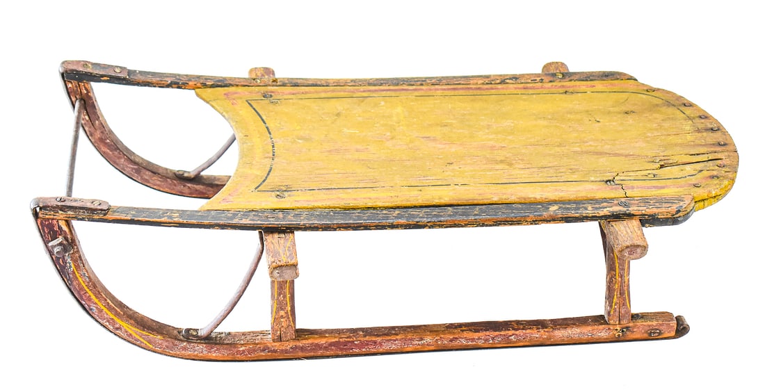AMERICAN PULL-BEHIND BENTWOOD CHILD'S CLIPPER SLED: An American pull-behind bentwood child's clipper sled with metal runners, from the late 19th-early 20th century. The item is marked "1810". The sled measures approx. 6.5" H x 14" W x 28" D.