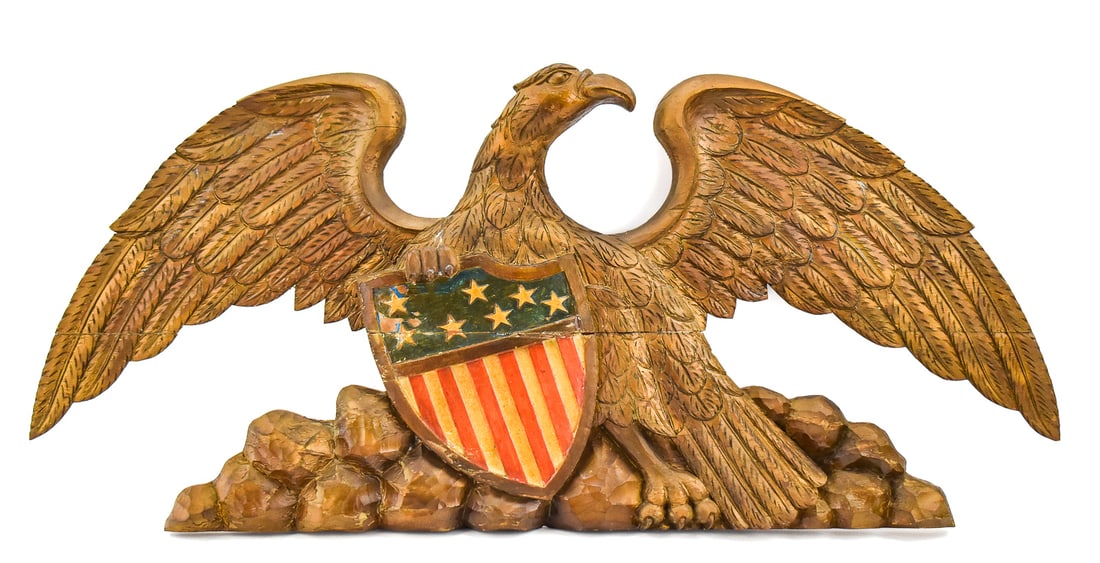 AMERICAN FEDERAL REVIVAL STYLE STERNBOARD EAGLE WALL PLAQUE: An American Federal Revival style carved polychrome sternboard eagle wall plaque, from the early-20th century. The item measures approx. 18" H x 39" W x 3" D.