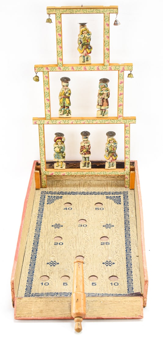 VICTORIAN CHILDREN SHOOTING GALLERY: Built in the late 18th to early 19th century, this is one of the first styles of toy shooting galleries produced. The goal was to shoot a small ball at the dishes on the children's heads and have it