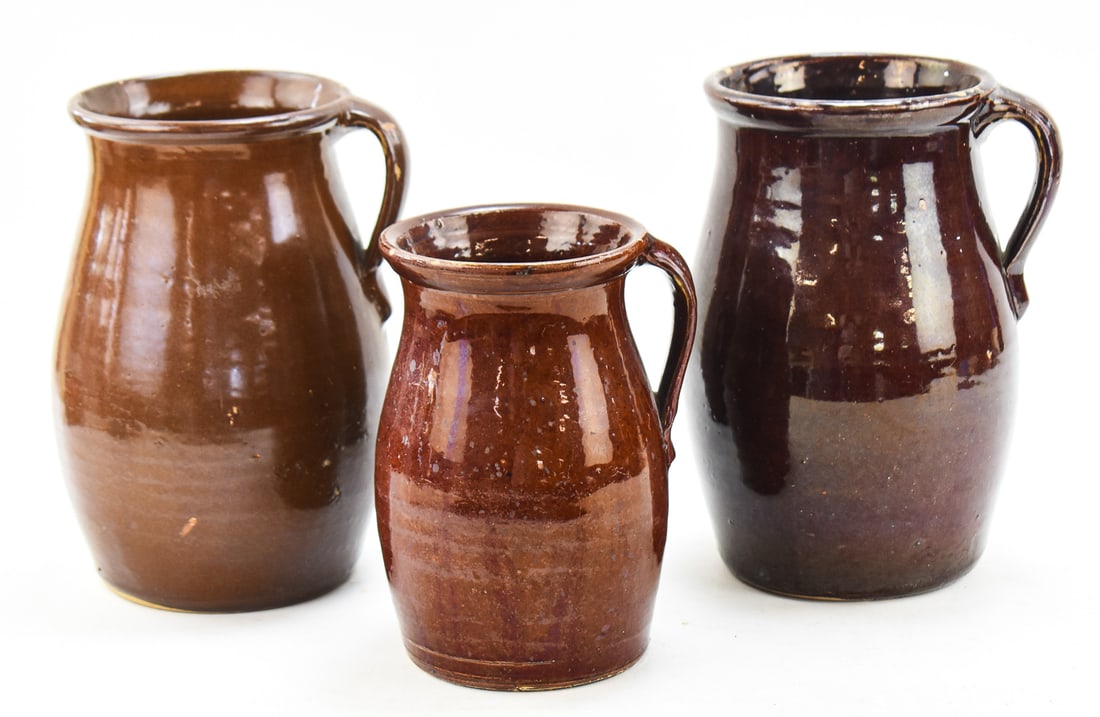 THREE ASSORTED BROWN STONEWARE PITCHERS (1 of 4)