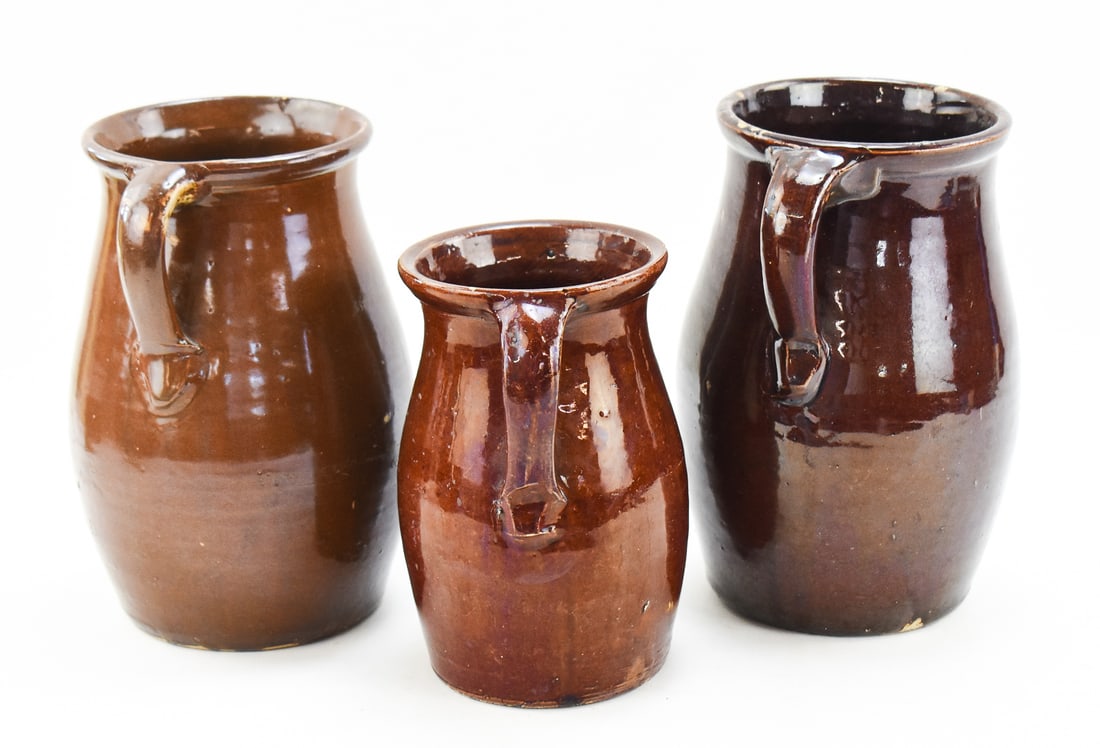 THREE ASSORTED BROWN STONEWARE PITCHERS - 3