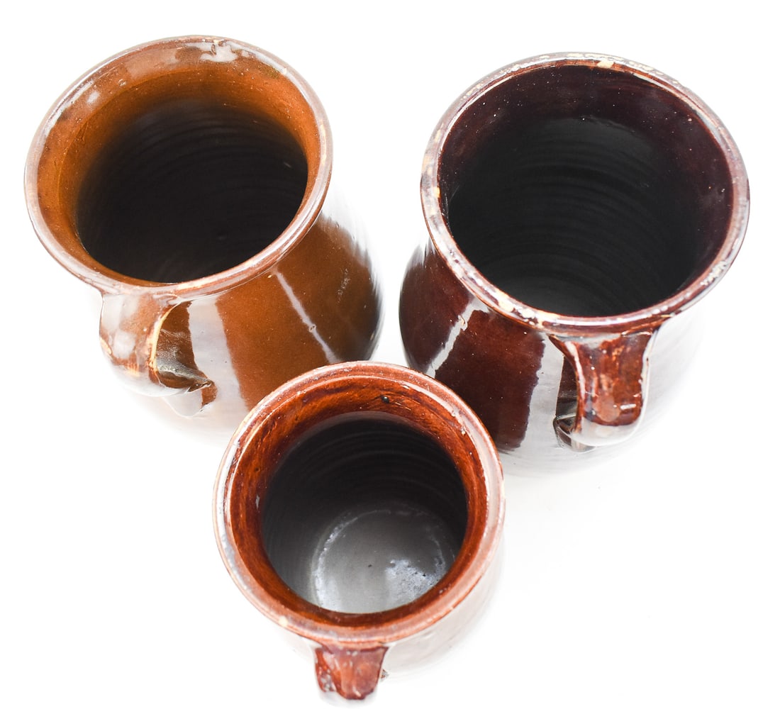 THREE ASSORTED BROWN STONEWARE PITCHERS - 4