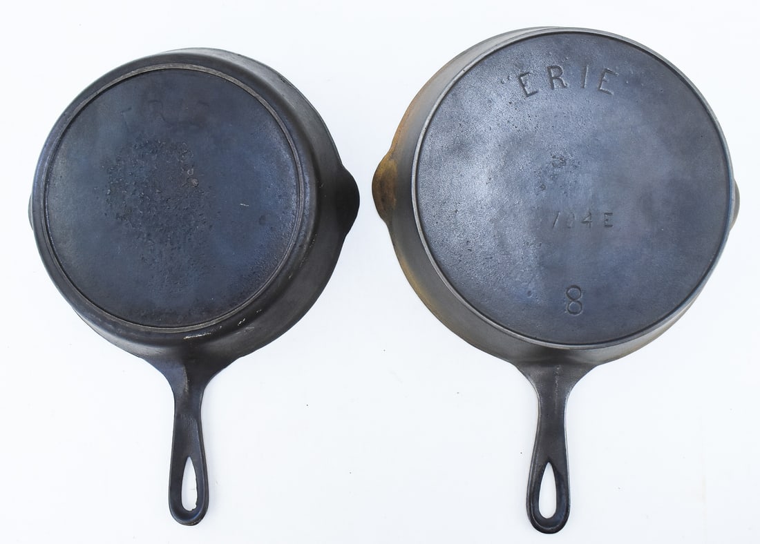 TWO PRE-GRISWOLD ERIE CAST IRON SKILLETS: PATTERN No. 104E (1 of 2)