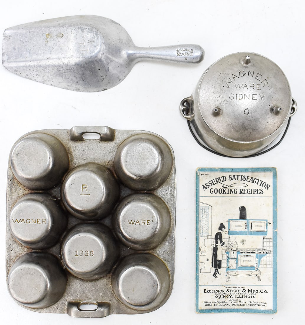 WAGNER CAST IRON KETTLE, SCOOP, MUFFIN PAN, AND MORE: This lot includes the following: Wagner Manufacturing Company (Sidney, OH) cast iron kettle, Wagner cast aluminum scoop, Wagner eight-cup cast iron muffin pan, and; an "Assured Satisfaction Cooking Re