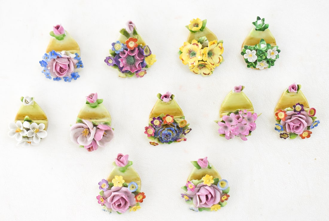 GERMAN CERAMIC FLORAL CARD HOLDERS: This lot consists of 11 German hand-made bone china floral card holders, stamped "Made in Germany"; mid-20th century. Each card holder measures approximately 1" H x 1.5" W 2" D.