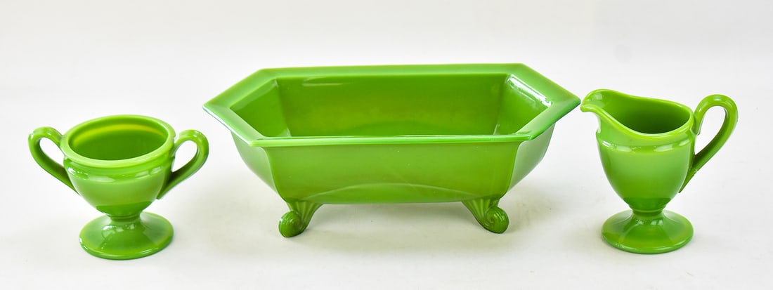 CAMBRIDGE GLASS "AVOCADO" GLASS SUGAR, CREAMER, AND FOOTED BOWL: Three pieces of Cambridge Glass "Avocado" glass including a sugar, creamer, and a hexagonal footed bowl. The bowl measures approximately 3.5" H x 12" W x 6" D.