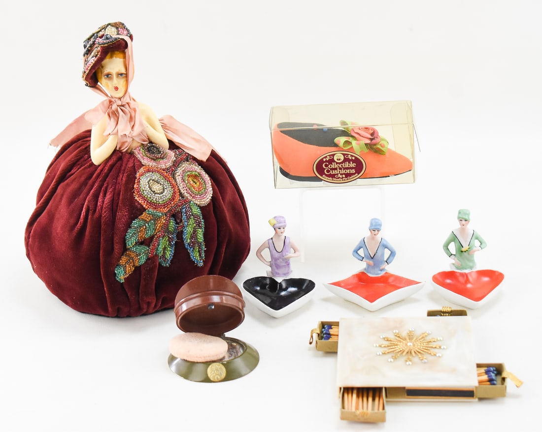 VANITY COLLECTION: FLAPPER FIGURAL TRINKET DISHES, HALF-DOLL, AND MORE: This lot includes the following: German porcelain half doll pin-cushion, Dritz Collectable Cushion Keepsake Novelty Pin Cushion in the shape of a Victorian slipper shoe, three German made figural