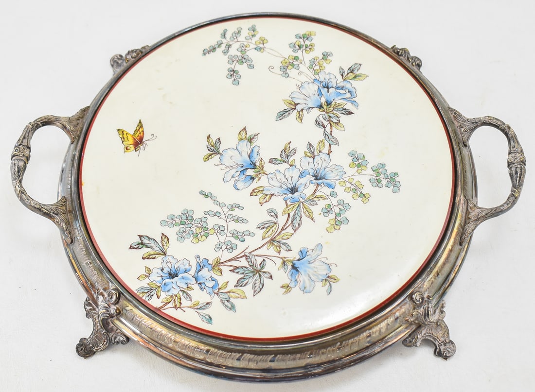 EUROPEAN VANITY TABLE PLATEAU: A Meissner Ofen-und Porzellanfabrik (Meissen, Germany) porcelain dish in a silverplate serving tray, circa 1882-1929. Tray measures approximately 2.5" H x 16" W x 13.5" D.