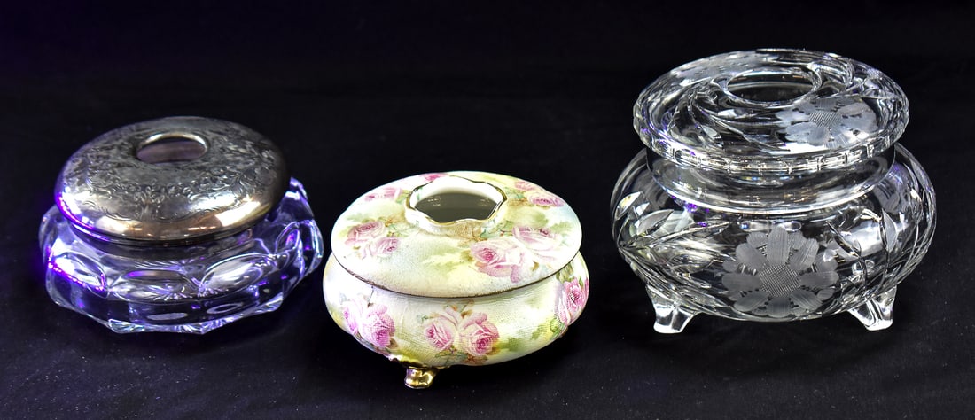THREE HAIR RECEIVERS: HOMAN, ROYAL BAYREUTH, AND MORE: This lot includes three hair receivers, early 20th century: a glass base hair receiver with Homan Manufacturing Company silver-plated lid, marked Royal Bayreuth (Bavaria, Germany) floral-painted porce