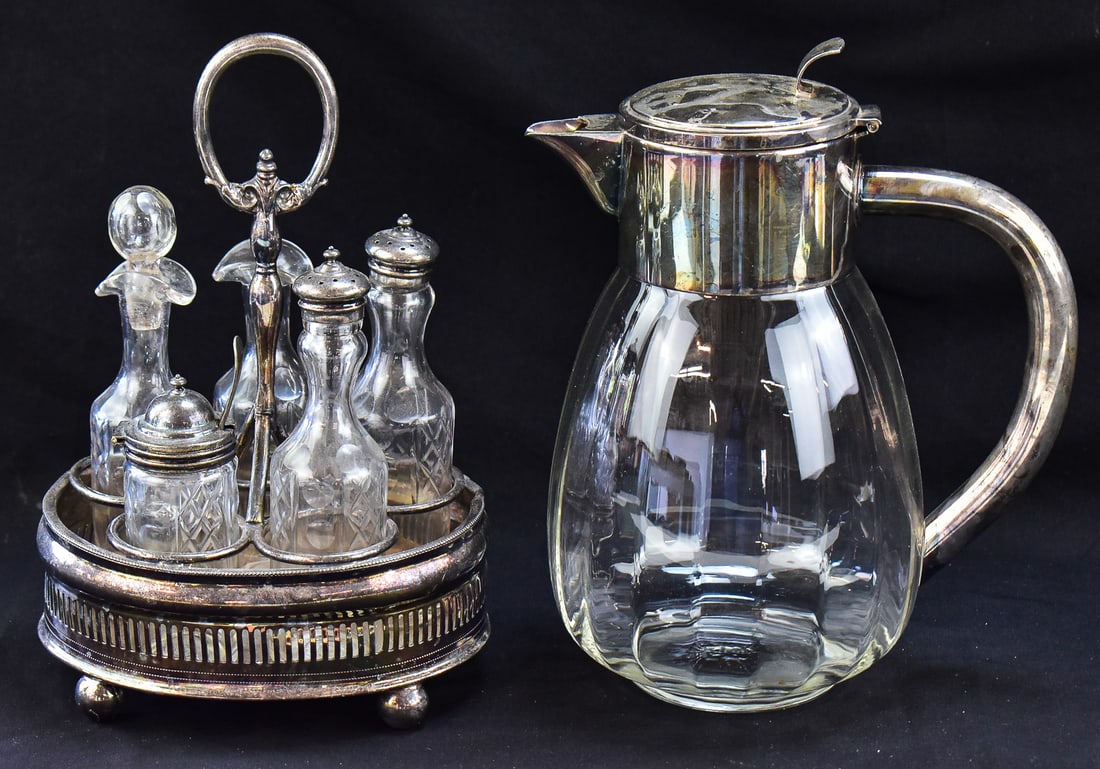EISENBERG-LOZANO CARAFE AND VICTORIAN CRUET SET: A Eisenberg-Lozano (Germany) silver-plate water carafe and a Victorian silver-plate cruet set. The carafe measures approximately 10.5" H x 5.5" W x 8" D.