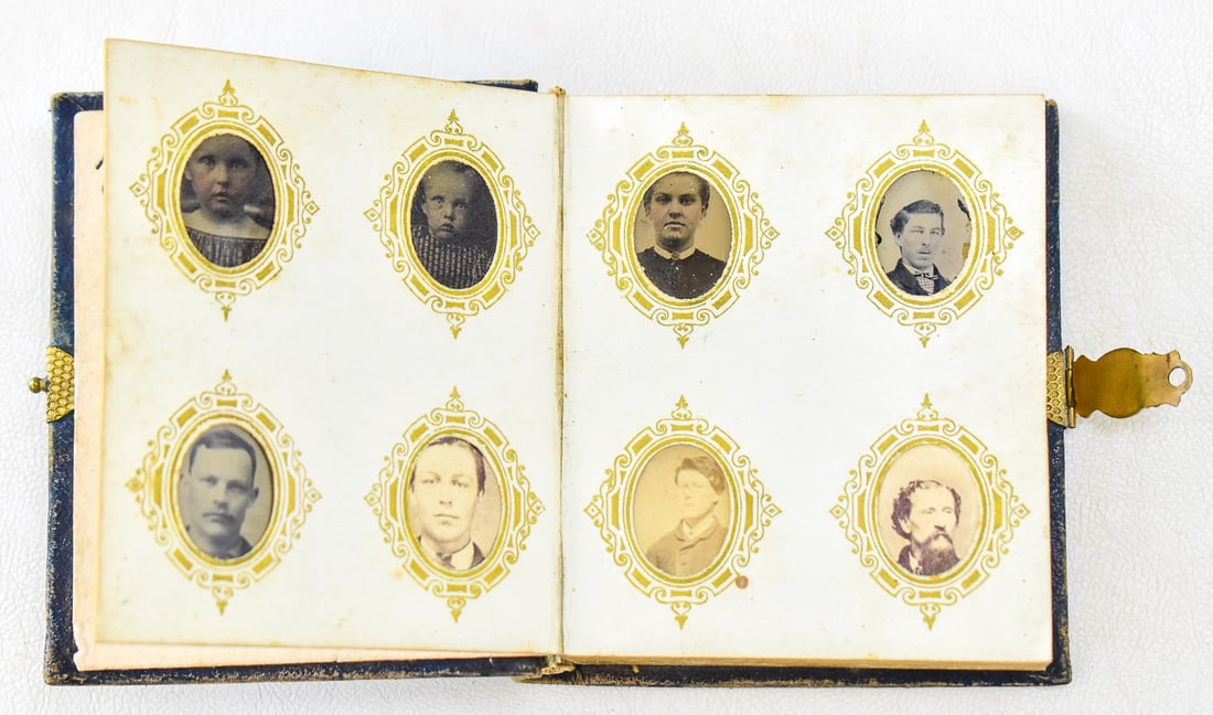 PAIR OF GEM PHOTO ALBUMS; SALT LAKE CITY: This lot consists of two gem photo albums with photography being shot in Salt Lake City, circa 1860-1870s: One album has a blue cross with gold accents on the front containing 66 tintypes and and the 