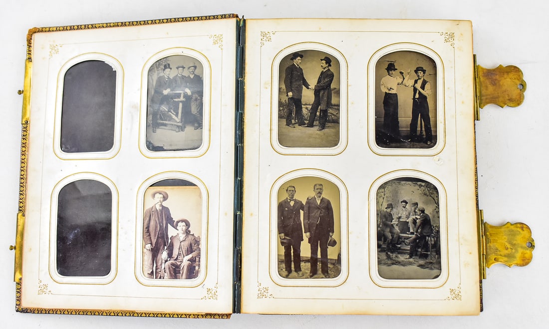 SAME SEX TINTYPE ALBUM: An Artemus & Company (Philadelphia, PA) "The Photographic Album" containing 68-tintypes of same sex individuals, circa mid-late 19th century. Album measures approximately 10" H x 8" W x 2.5" D.