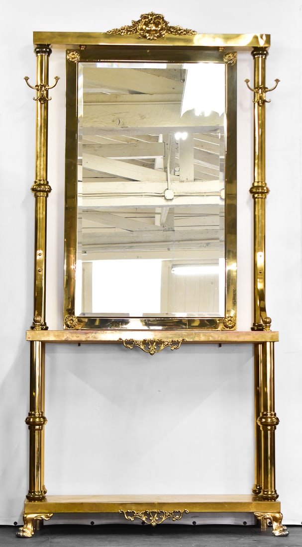 HOLLYWOOD REGENCY STYLE BRASS HALL TREE: This hall tree has a console table, mirror, claw feet and eight hooks. This resurgence was common in the mid 20th century dating this to circa 1970s. The entire hall tree is made of brass and