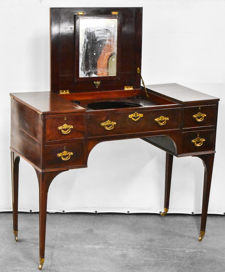 QUEEN ANNE STYLE MAHOGANY VANITY DESK: This desk is made mahogany wood with brass hardware. There are multiple cubbies within the desk. The desk closed measures approximately 33.5" H x 41.5" W x 19" D.