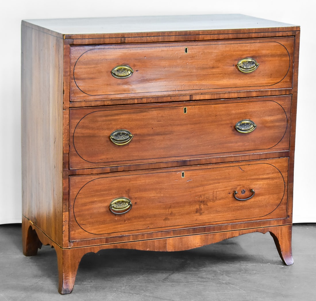 GEORGE lll STYLE THREE-DRAWER CHEST: A George III English mahogany veneered chest featuring three oak drawers with brass hardware. The item measures approximately 36" H x 36" W x 18.5" D.