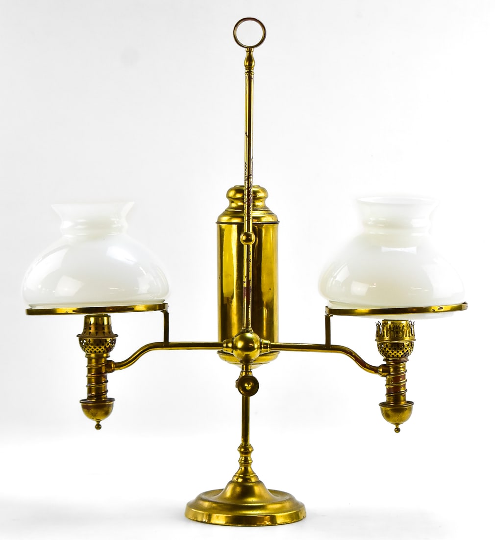 DOUBLE ARM BRASS STUDENT LAMP: This lamp was manufactured by the Manhattan Brass Company in New York City, New York in between Dec 25th 1977-May 20th 1979. The lamp measures approximately 25.5" H 22.5" W x 7.5" D.