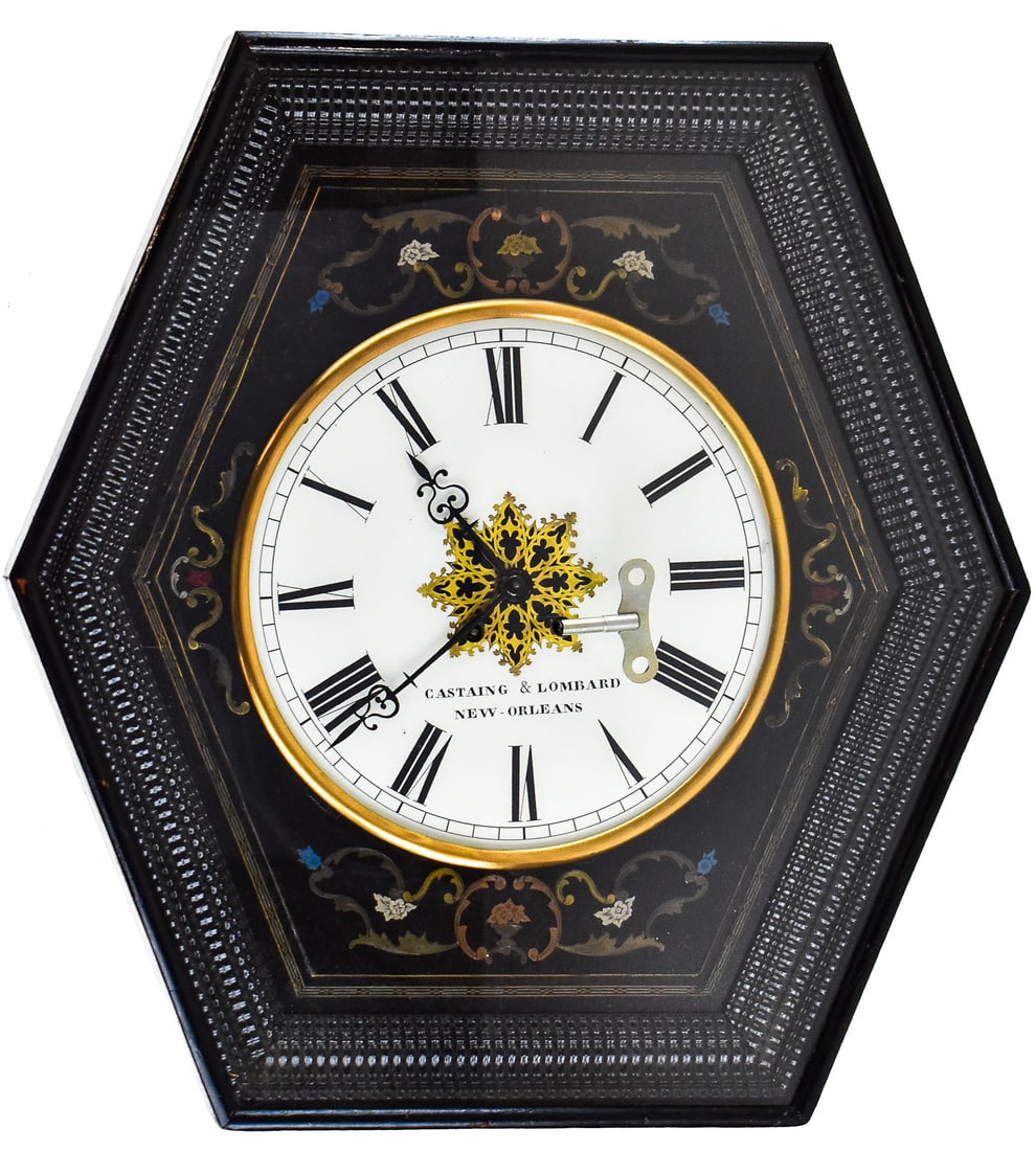 "BULL'S EYE" FRENCH NAPOLEON III HEXAGONAL WALL CLOCK: A "Bull's Eye" French hexagonal wall clock from the Napoleon III era. The case is made of ebonized wood, with metal and enameled inlays set into the front of the clock case. The clock case is hinged