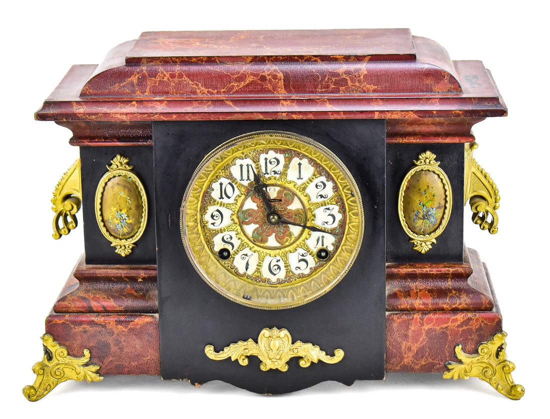 SESSIONS "TRITON" 8-DAY MANTLE CLOCK: A Sessions "Triton" 8-day mechanical movement mantle clock with a faux-marble case with brass hardware, and oval shaped painted brass decals on either side of the clock face, produced in the