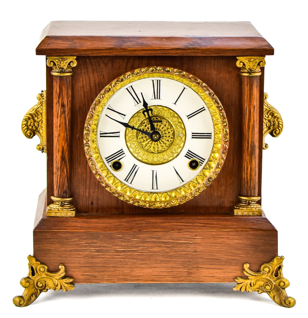 INGRAHAM CLOCK COMPANY NEOCLASSICAL MANTLE CLOCK: An Ingraham Clock Company Neoclassical style 8-day mantle clock, late 19th century. The item measures approximately 11" H x 11.5" W x 6" D.