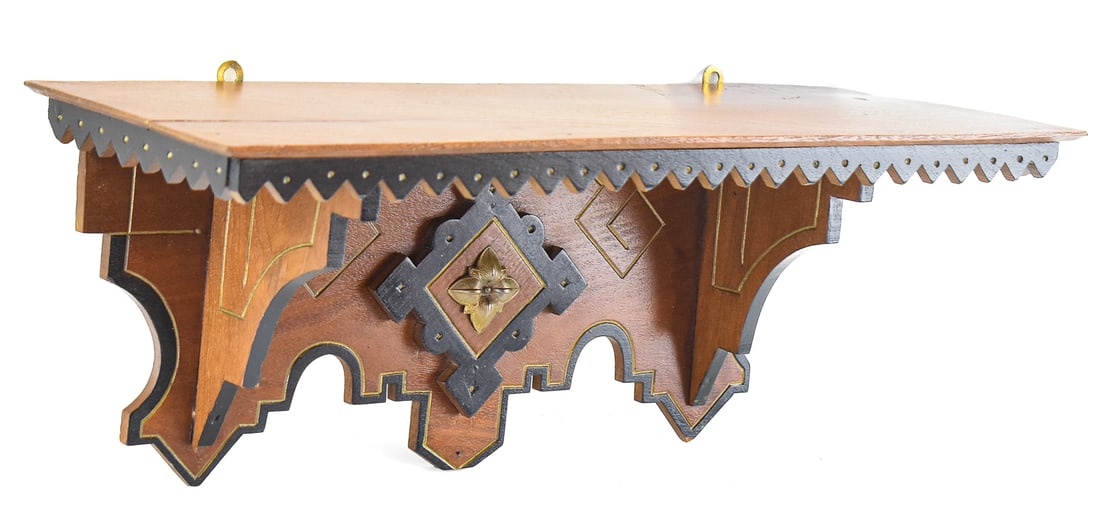 EASTLAKE STYLE CLOCK WALL SHELF: The shelf is made out of walnut wood and ebonized wood circa 1890s. Originally deigned as a shelf to support a mechanical mantle clock. The shelf measures approximately 8" H x 19.5" W x 7" D.